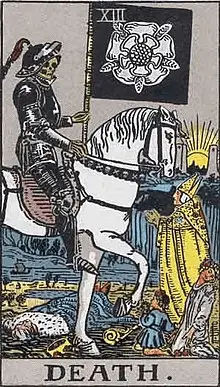 The Death Card of The Rider Waite Tarot Deck. A skeleton sits on a pale horse, carrying a black flag. People fall dead at its feet.