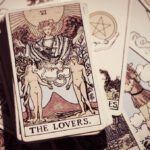 Tarot deck spread on table with the lovers card face up