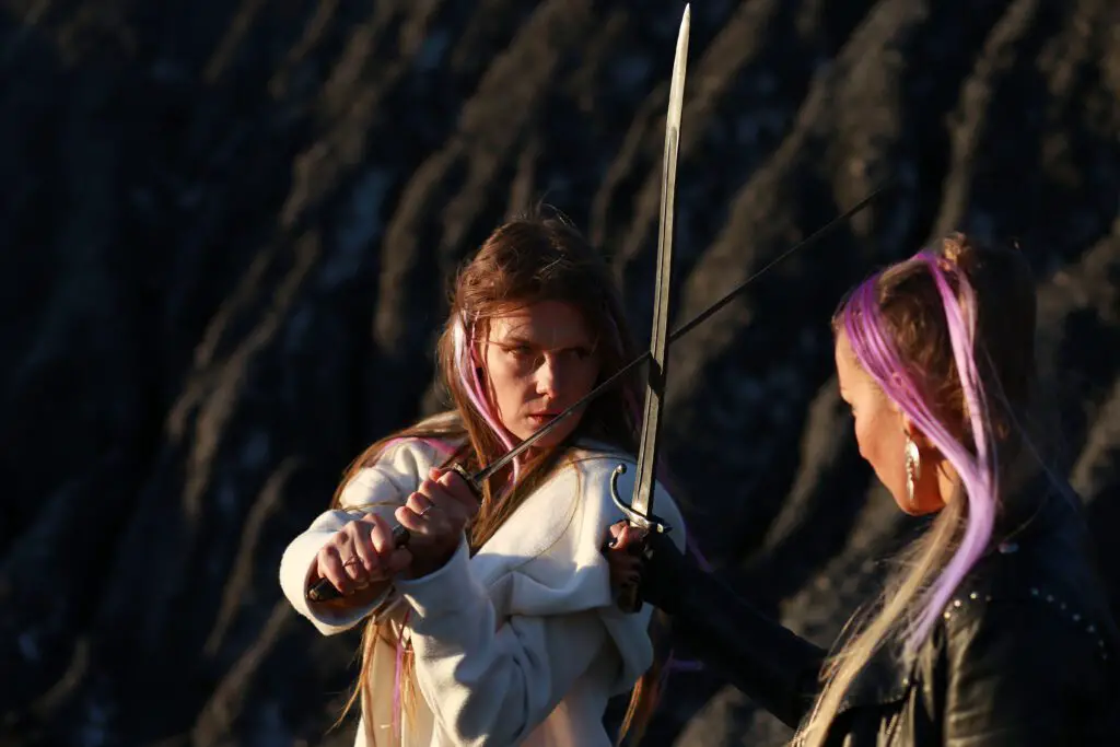 two women sword fight