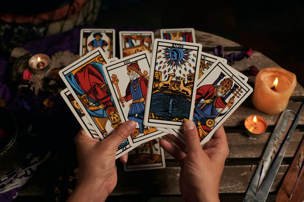 Connect with your new tarot deck by holding it in your hands, transferring your energy and intentions. 