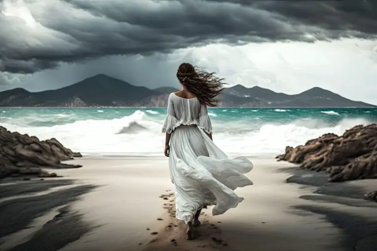 A beautiful young woman in a flowing white dress barefoot walks